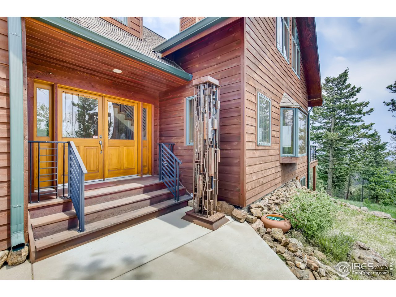 98 Rim Road Boulder, CO 80302 - Photo 3 of 31 a view of a house with a porch