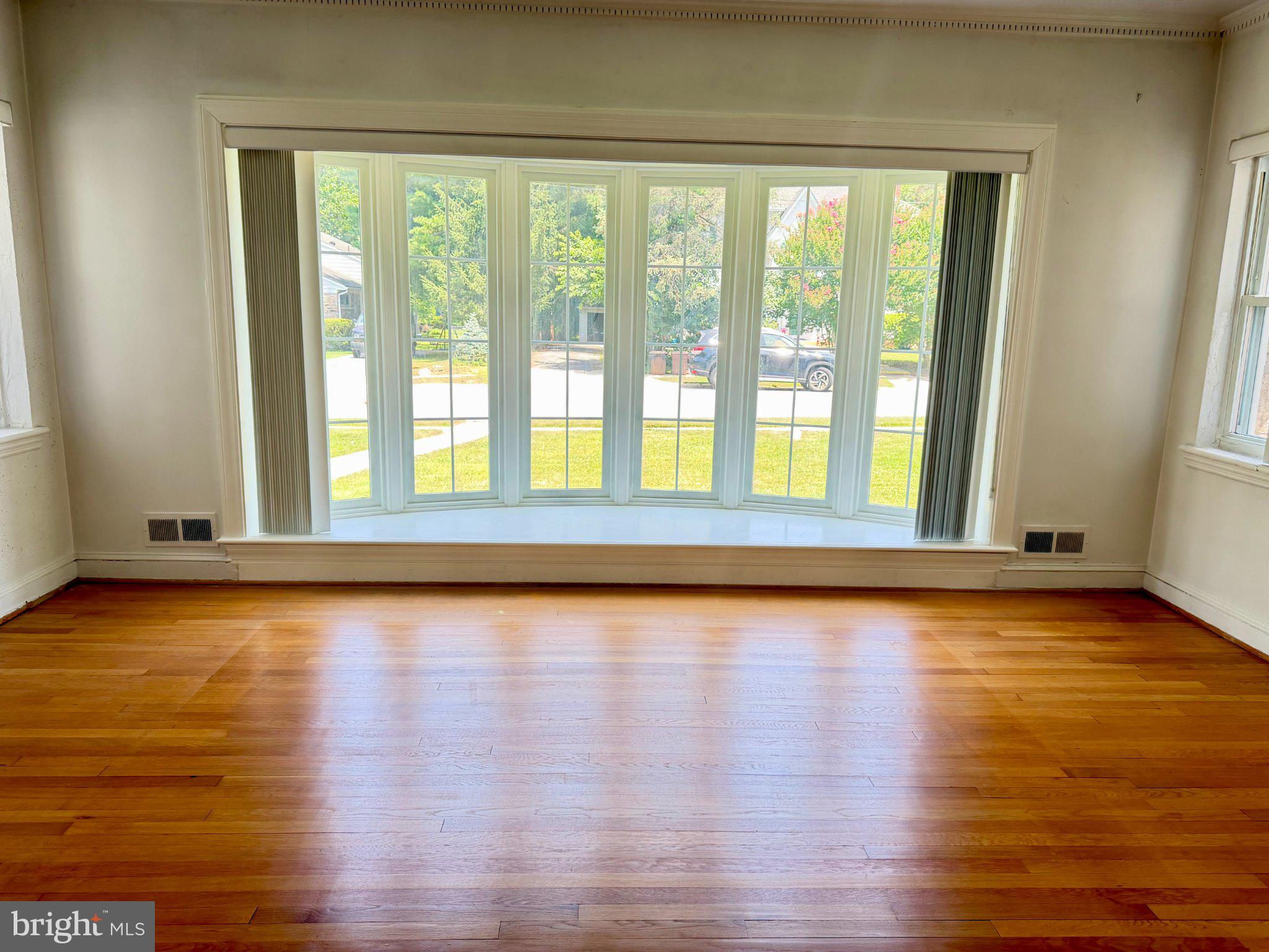 6318 Winner Avenue Baltimore, MD 21215 - Photo 9 of 75 a view of room with window and wooden floor
