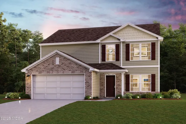 a front view of a house with a yard