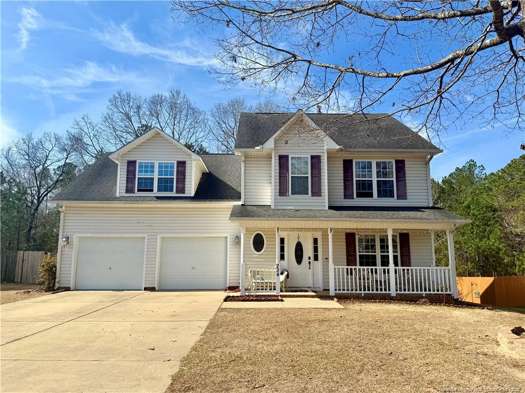234 Pender Road Spring Lake, NC 28390 - Photo 1 of 39 a front view of a house with a yard