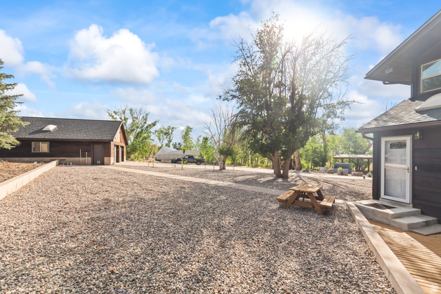 460 Omni Point Road Central Valley, UT 84754 - Photo 72 of 101 Expansive gravel driveway featuring multiple structures