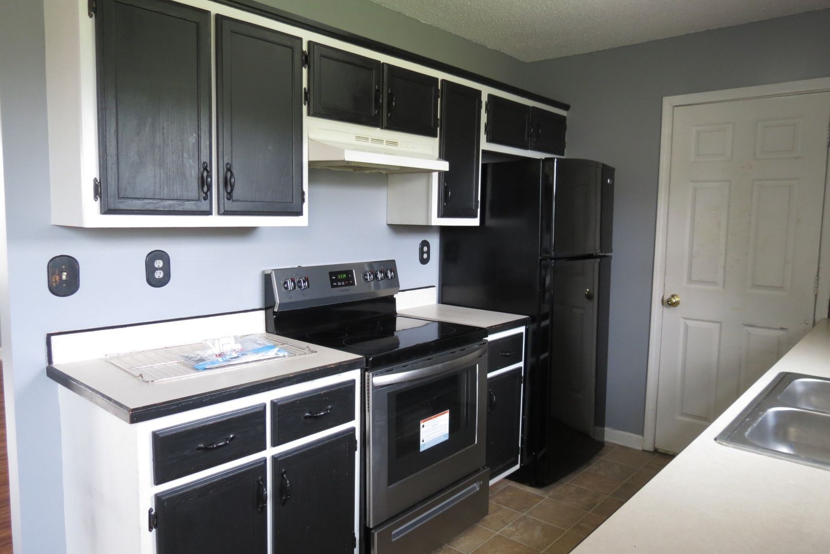 200 Rusty Drive Oak Grove, KY 42262 - Photo 2 of 14 a kitchen with stainless steel appliances granite countertop a sink stove and refrigerator