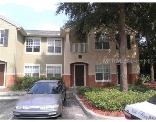 4360 South Kirkman Road, Unit 411 Orlando, FL 32811 - Photo 1 of 1 a front view of a house with garden