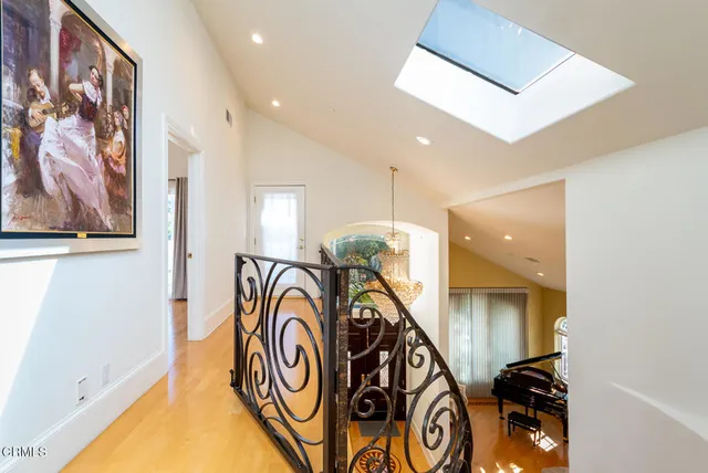 a view of a chairs and table in the balcony