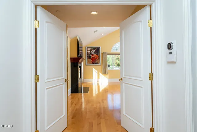 a spacious bathroom with a double vanity sink and a mirror
