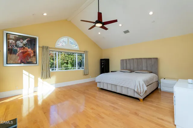 a bathroom with a tub a sink and a mirror