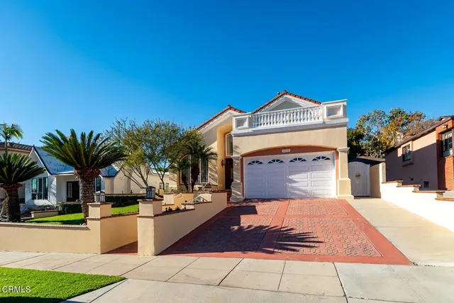 a view of a brick house with a large windows