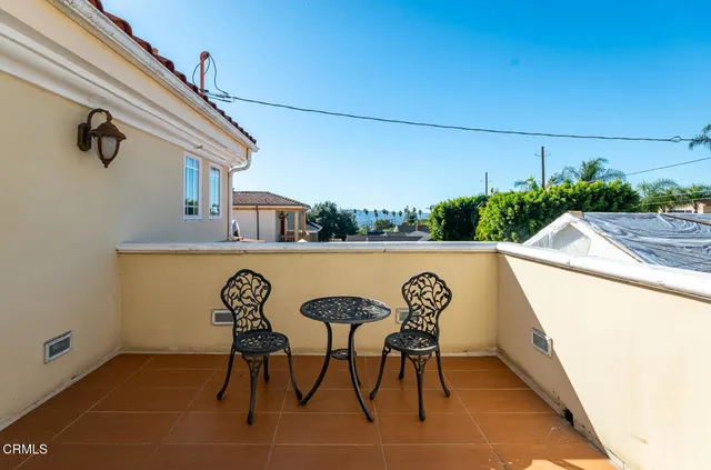 a bedroom with a bed furniture and a window