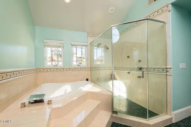 a view of a patio with a table chairs and a backyard