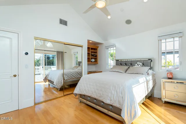 a view of a chair and table in backyard of the house