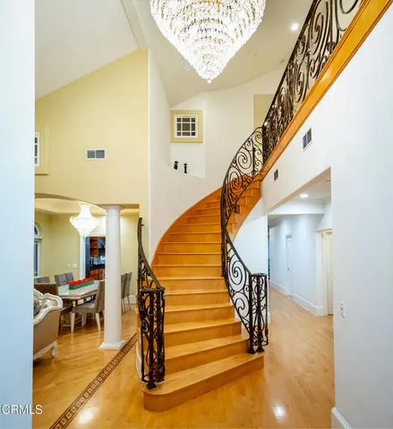 a living room with fireplace furniture and a wooden floor