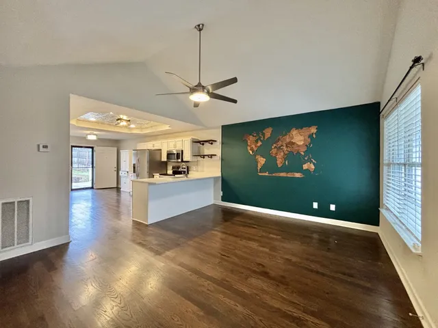 a view of kitchen and dining room with wooden floor