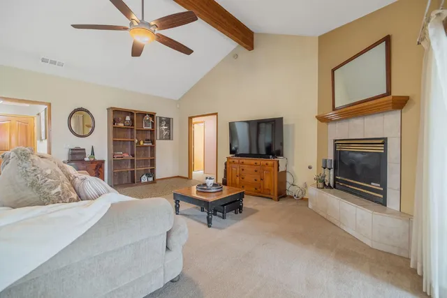 a kitchen with refrigerator and cabinets