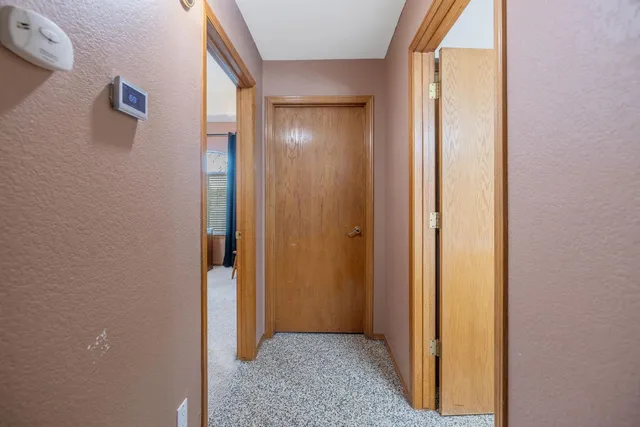 a view of a bedroom from a hallway