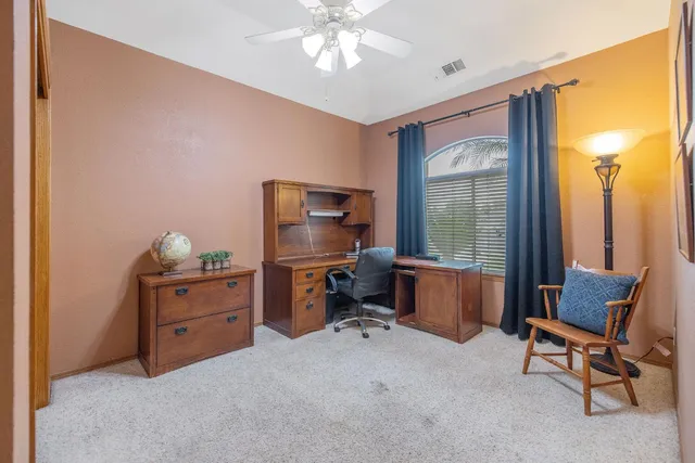 a spacious bathroom with a double vanity sink mirror and a shower