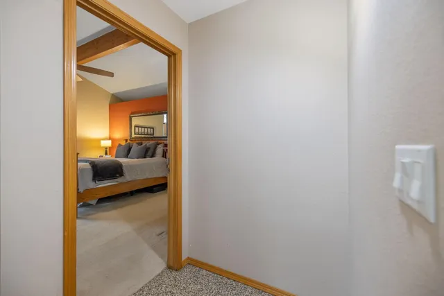 a view of a patio with a table and chairs under an umbrella