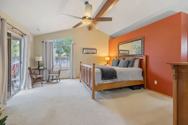 a view of a chairs and table in backyard of the house