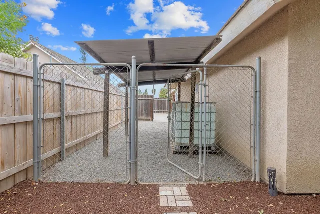 a swimming pool with outdoor seating yard and barbeque oven