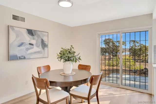a dining room with furniture and window