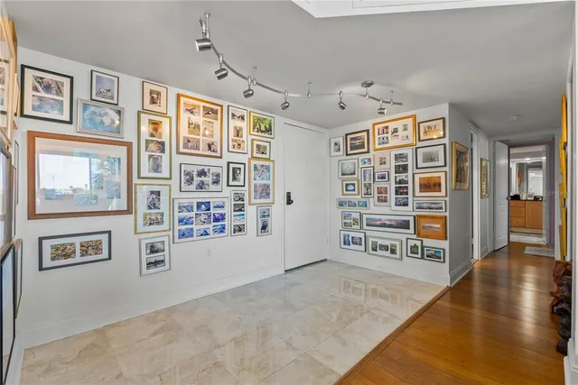 a bathroom with a granite countertop sink a mirror and a shower