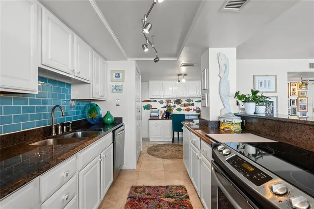 a living room with furniture and a book shelf