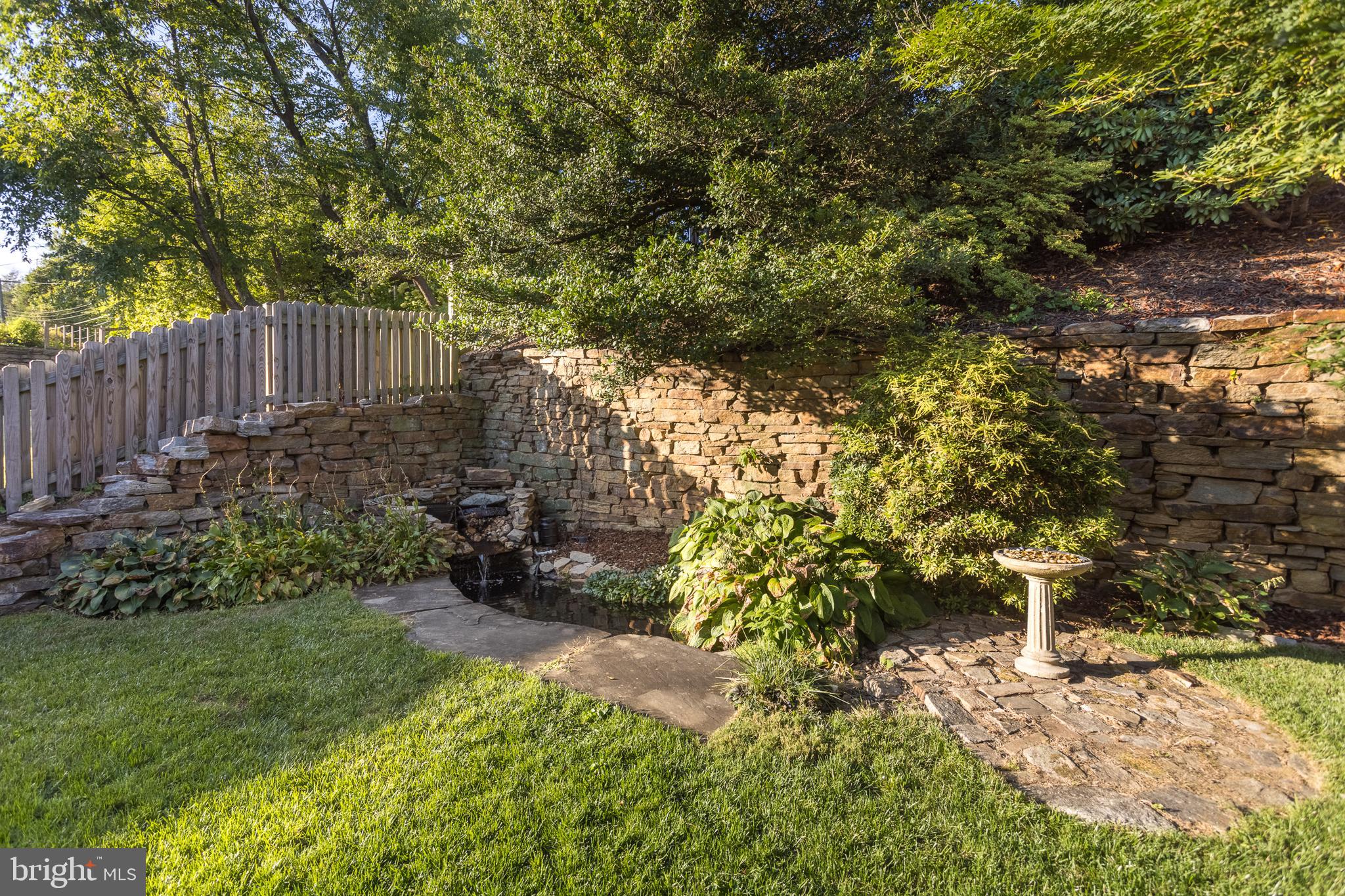 416 Aigburth Road Towson, MD 21286 - Photo 29 of 37 Backroom with stone retaining wall & koi pond