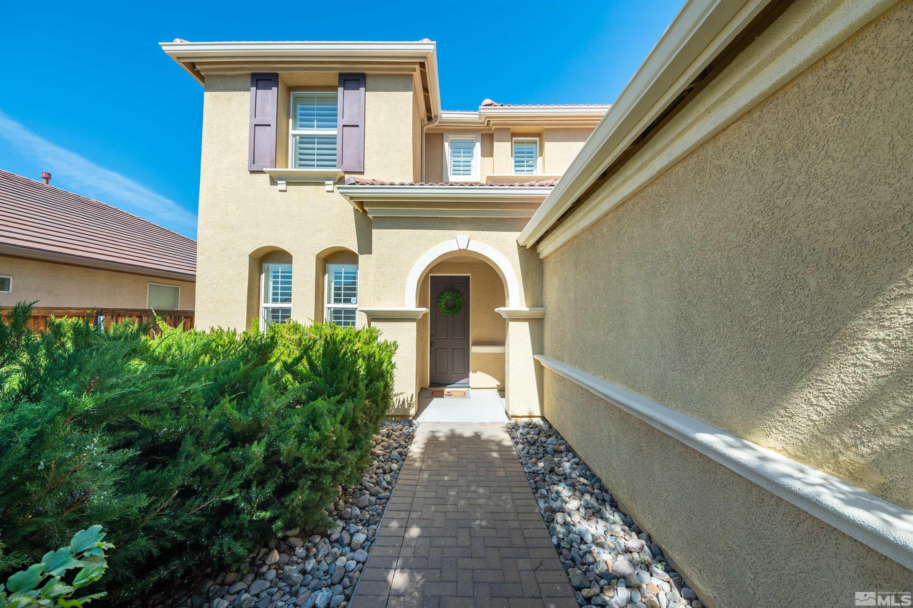 475 Cortono Drive Reno, NV 89521 - Photo 3 of 39 a front view of a house with garden