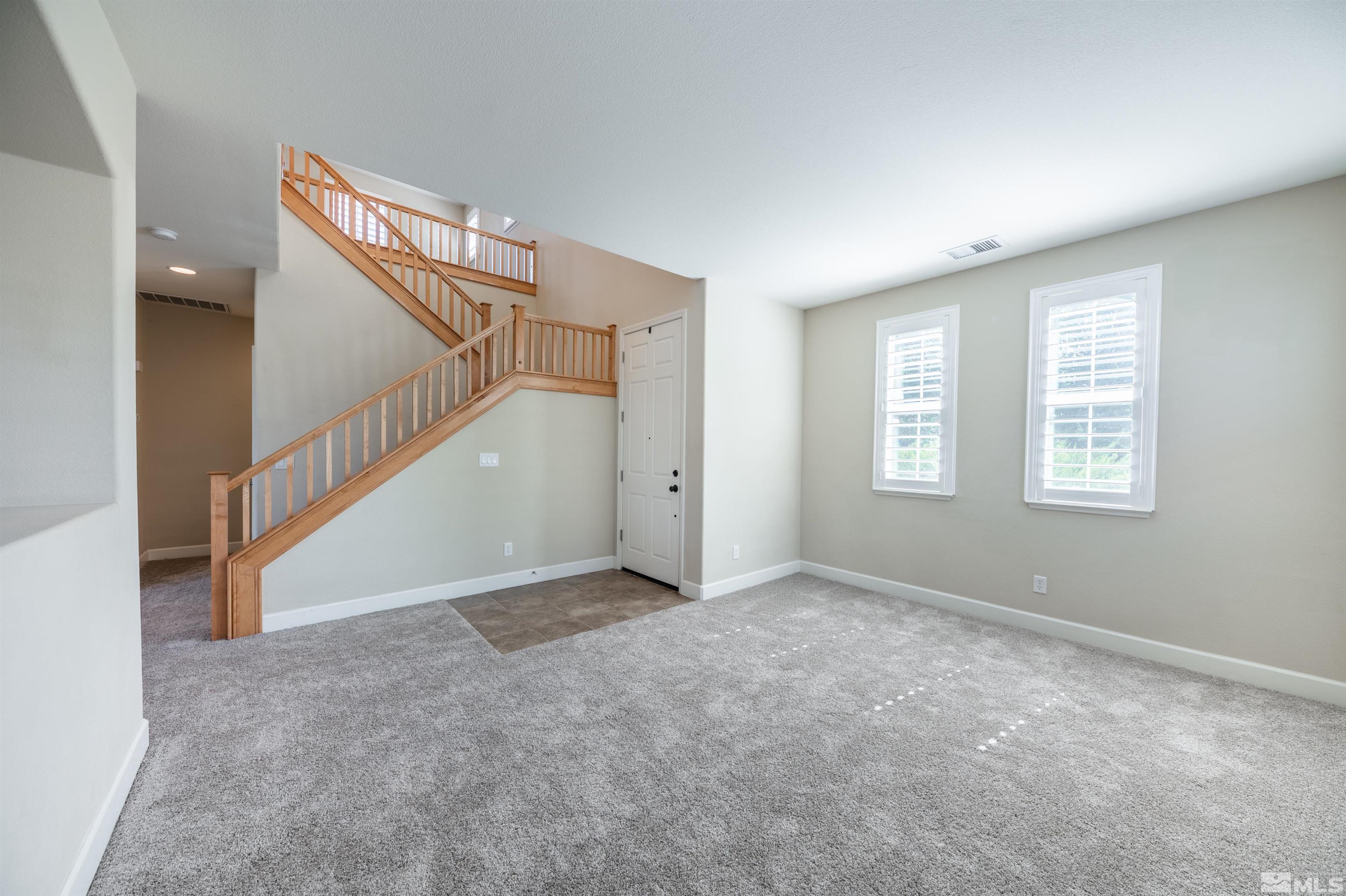 475 Cortono Drive Reno, NV 89521 - Photo 6 of 39 a view of an empty room with windows