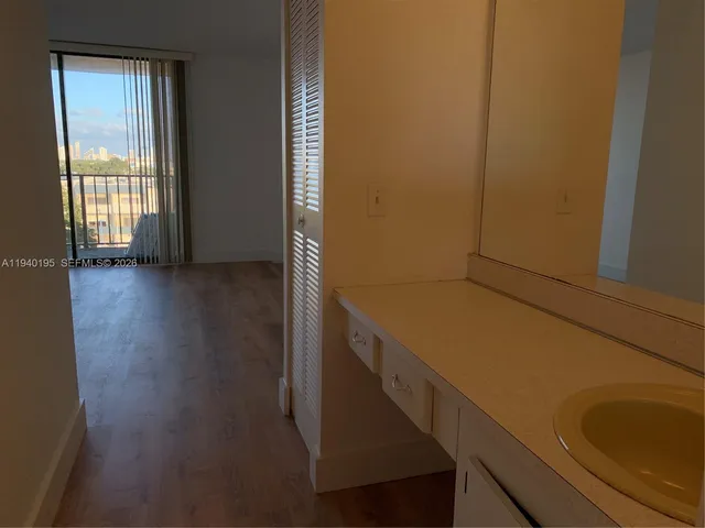 a view of storage and utility room with windows