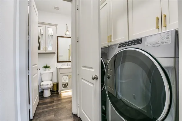 a view of a hallway with washer and dryer