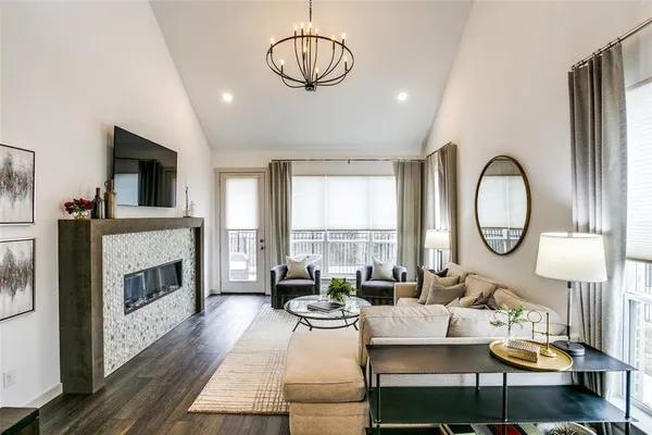 a living room with fireplace furniture and a fireplace