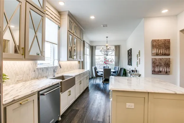 a kitchen with a sink stove and wooden cabinets