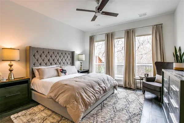 a bedroom with a large bed and a couch