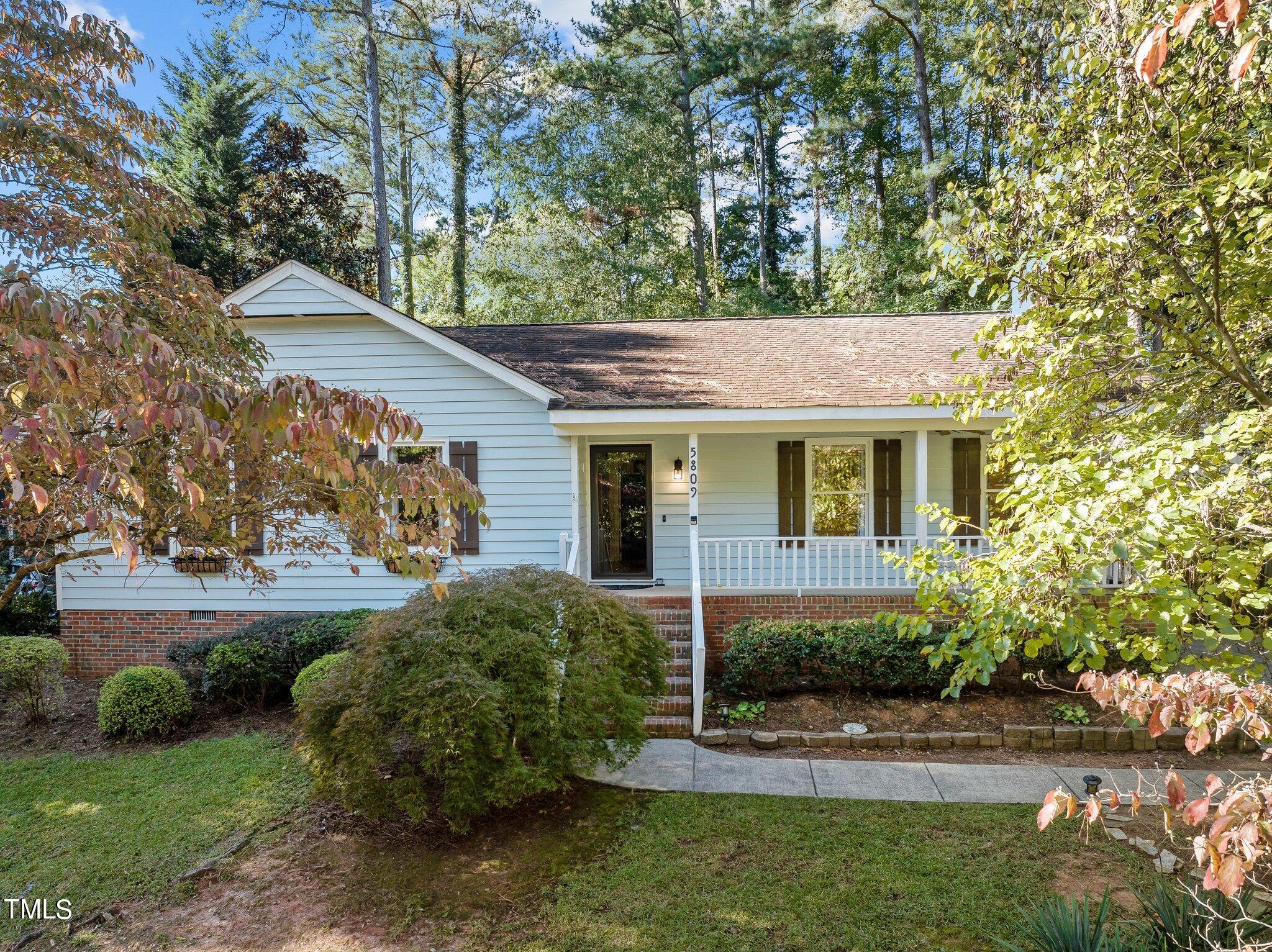 5809 Heatherbrook Circle Raleigh, NC 27612 - Photo 7 of 42 You an look at the beautiful fall foliage from the covered front porch with swing and overhead fan.