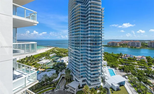 a view of a dining room with furniture and a floor to ceiling window