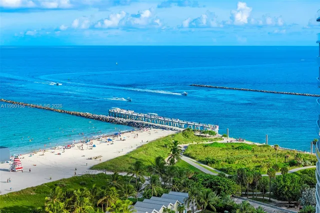 a view of a balcony with lake view and a floor to ceiling window