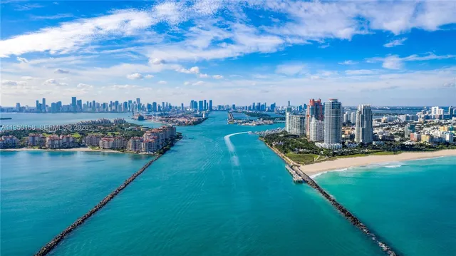 a living room with furniture a flat screen tv and a large window