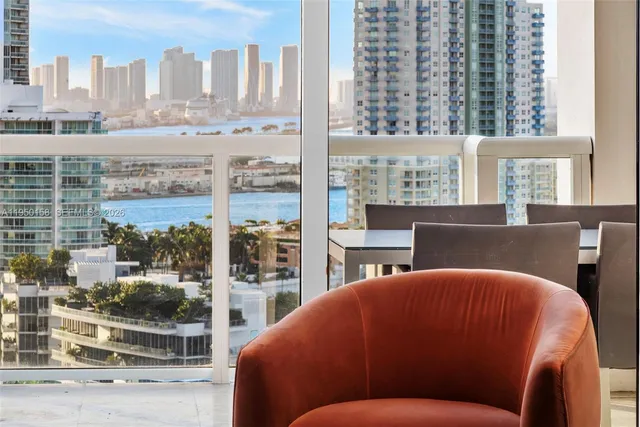 a spacious bedroom with a bed and a flat screen tv