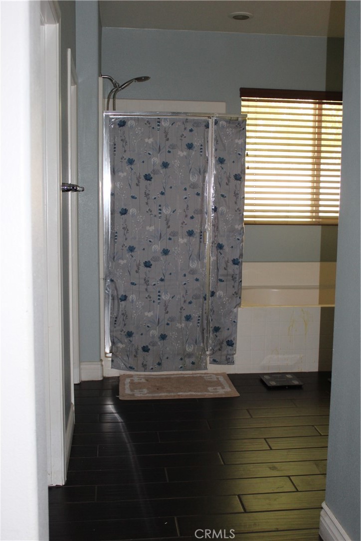 1382 Sunset Avenue Perris, CA 92571 - Photo 14 of 23 a view of a bathroom with a sink and a window
