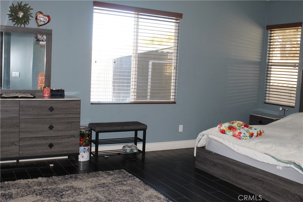 1382 Sunset Avenue Perris, CA 92571 - Photo 15 of 23 a bedroom with a bed and a dresser