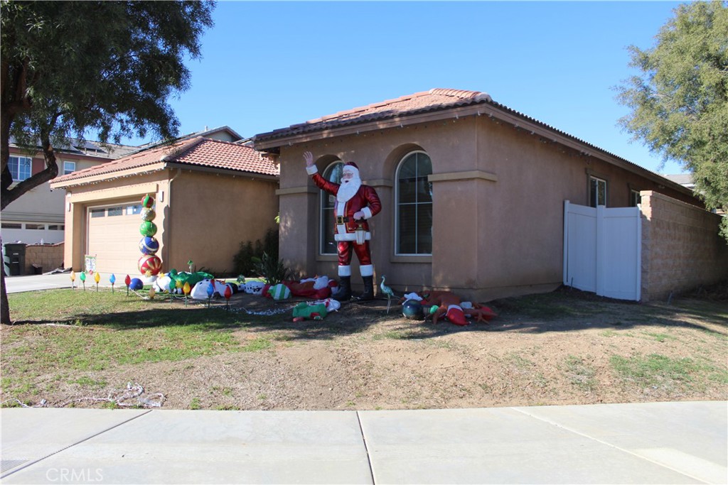 1382 Sunset Avenue Perris, CA 92571 - Photo 2 of 23 a front view of house with yard
