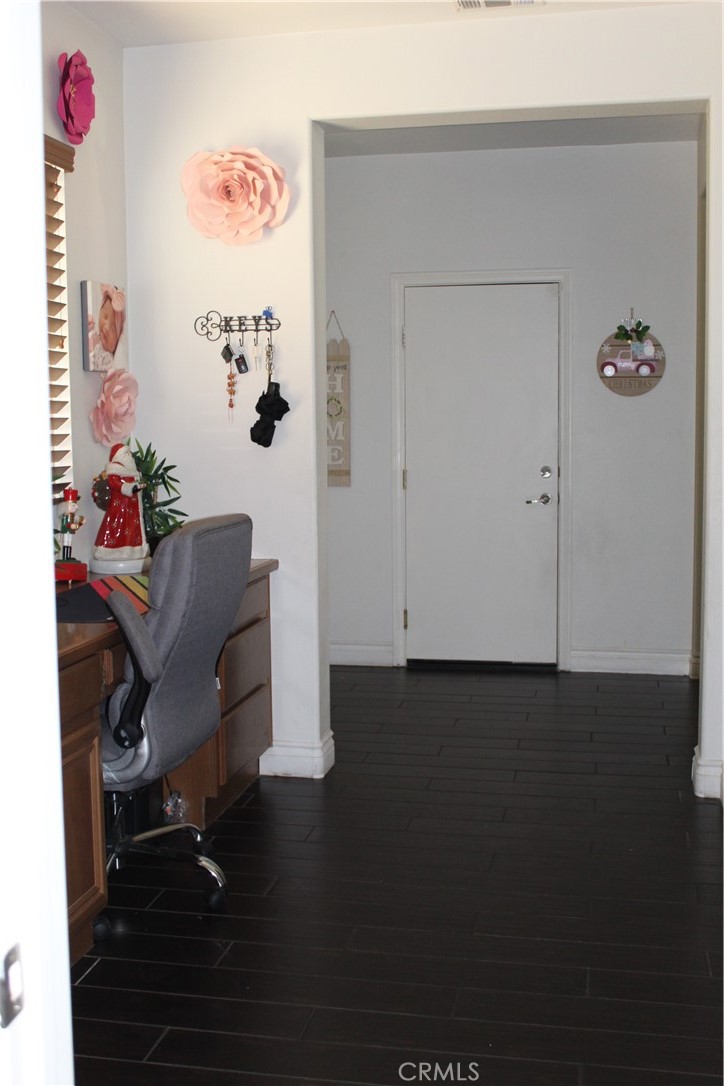 1382 Sunset Avenue Perris, CA 92571 - Photo 23 of 23 a workspace with furniture and wooden floor