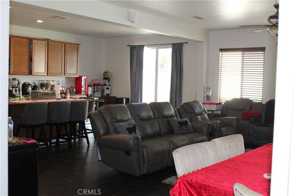 1382 Sunset Avenue Perris, CA 92571 - Photo 6 of 23 a living room with furniture and wooden floor