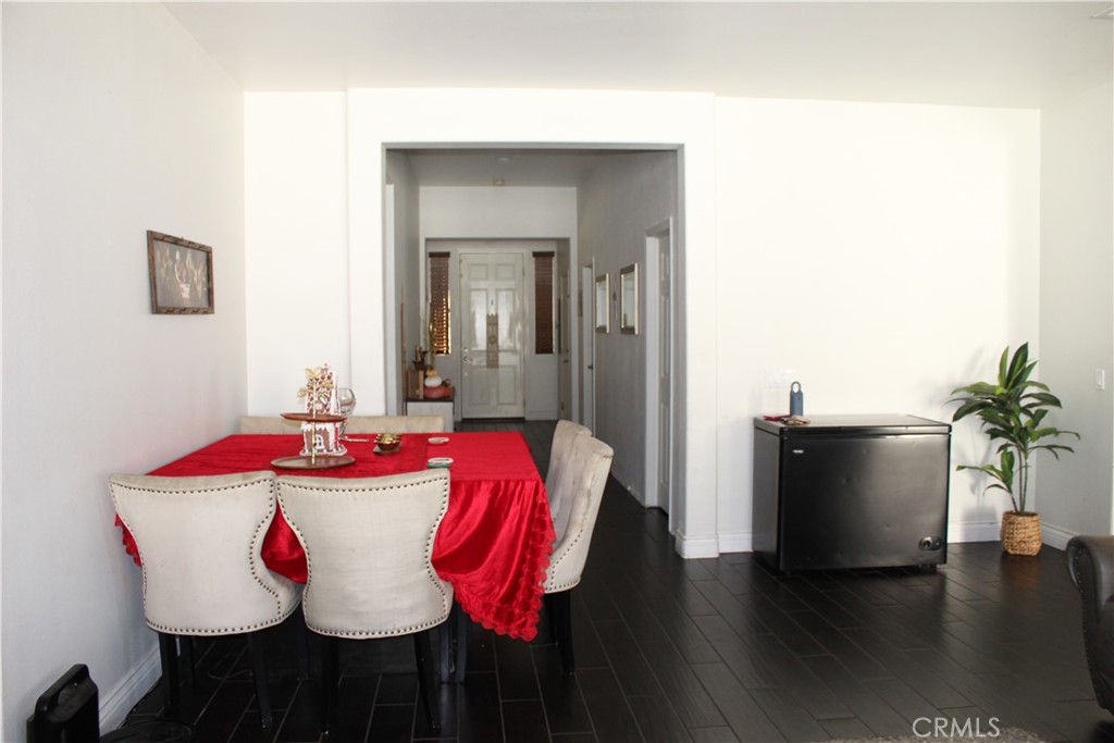 1382 Sunset Avenue Perris, CA 92571 - Photo 7 of 23 a view of a dining room with furniture and wooden floor
