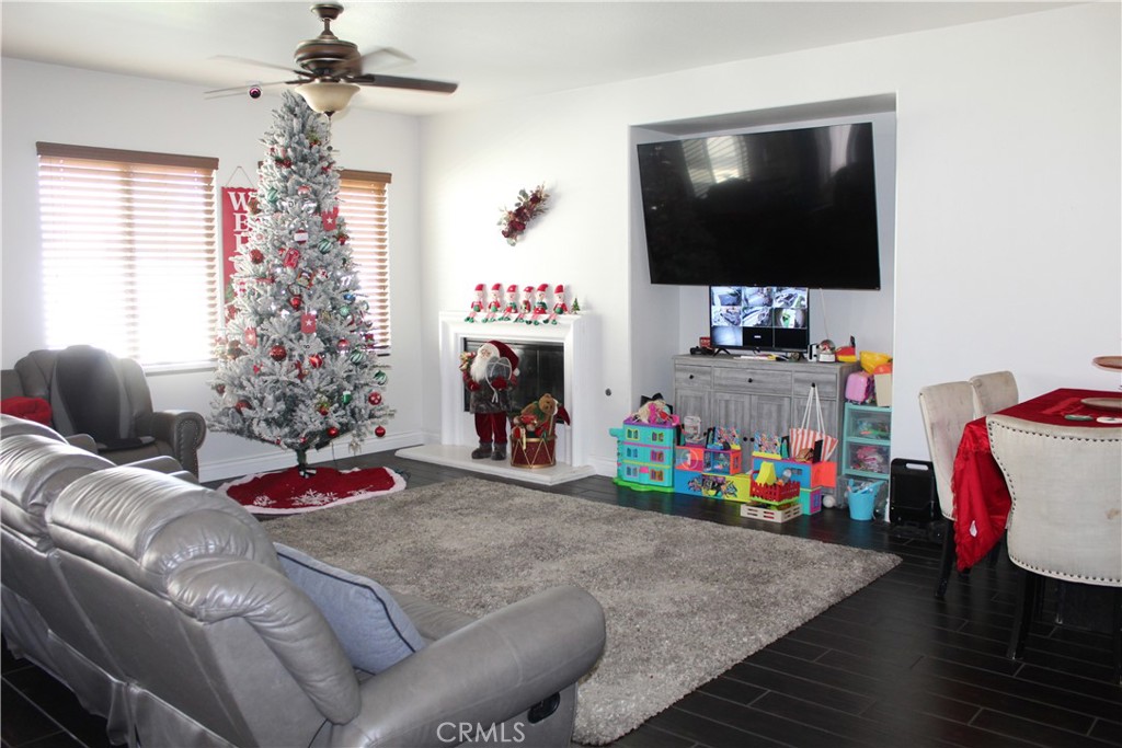 1382 Sunset Avenue Perris, CA 92571 - Photo 9 of 23 a living room with furniture and a flat screen tv