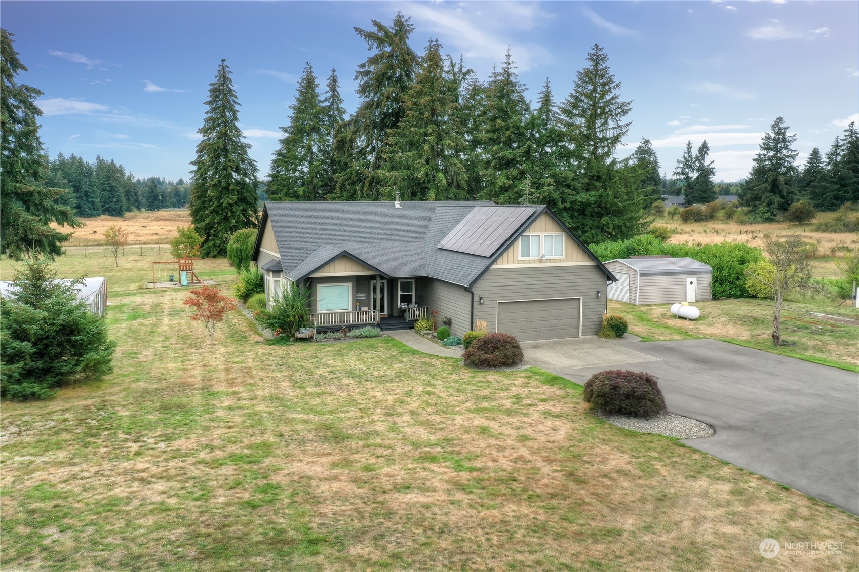 16637 Sheldon Lane Southwest Rochester, WA 98579 - Photo 1 of 40 a house with trees in the background