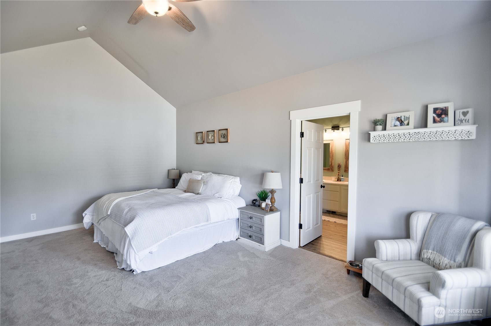 16637 Sheldon Lane Southwest Rochester, WA 98579 - Photo 18 of 40 a bedroom with a bed couch and painting on the wall