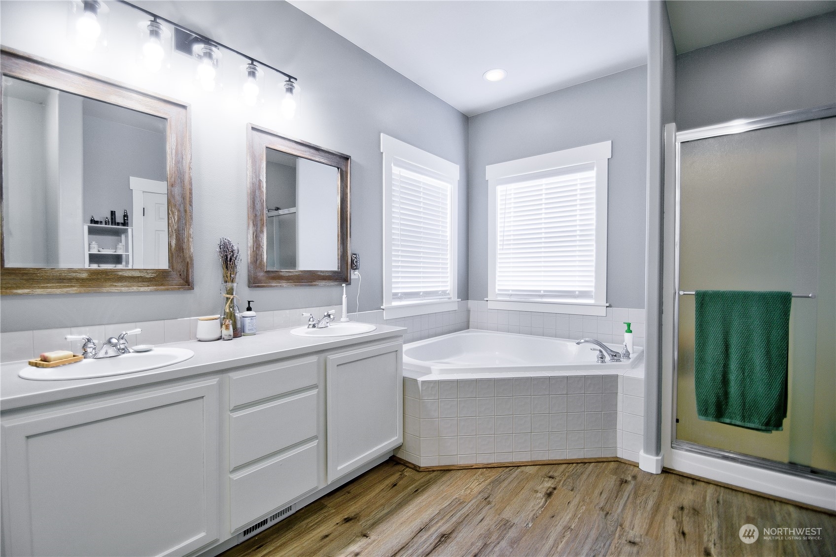 16637 Sheldon Lane Southwest Rochester, WA 98579 - Photo 19 of 40 a bathroom with a double vanity sink mirror and bathtub