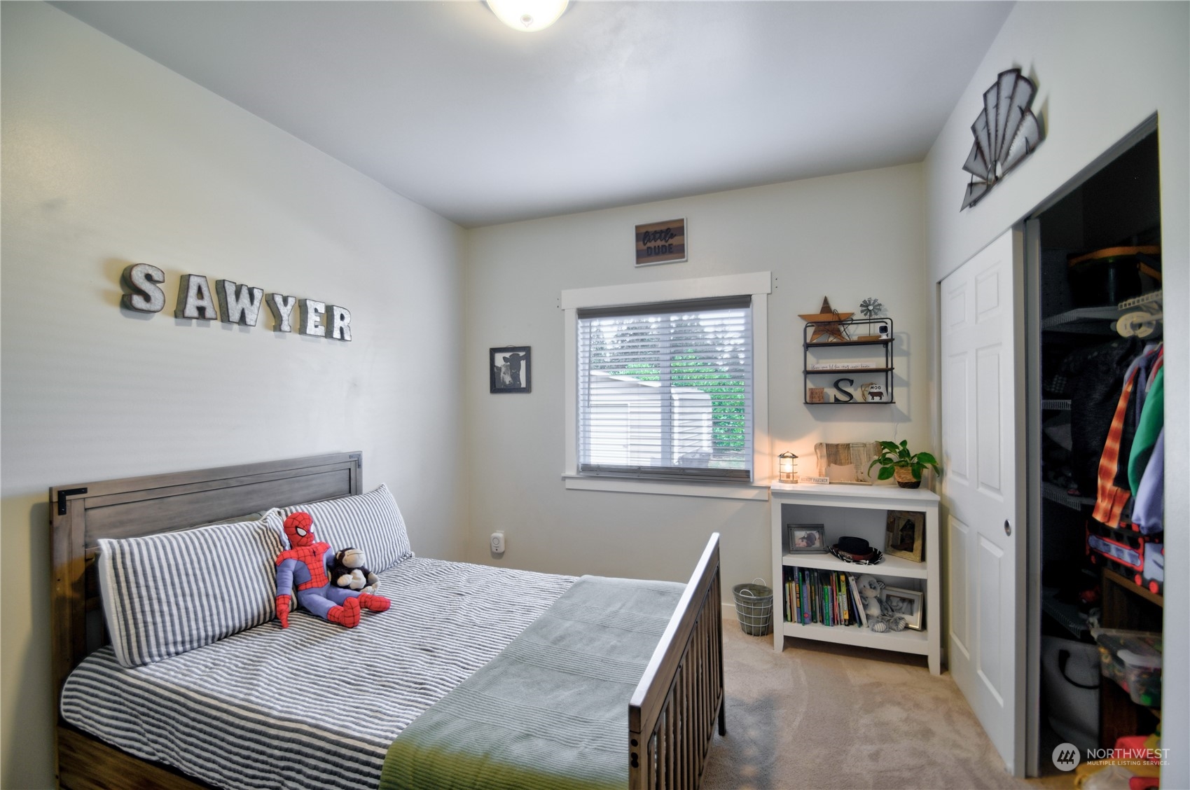 16637 Sheldon Lane Southwest Rochester, WA 98579 - Photo 23 of 40 a bedroom with a bed and a book shelf