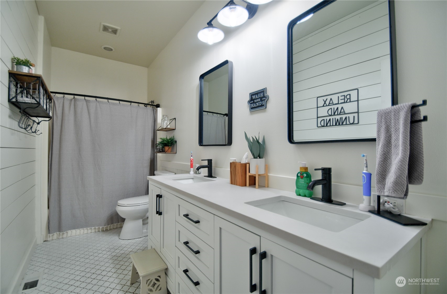 16637 Sheldon Lane Southwest Rochester, WA 98579 - Photo 25 of 40 a bathroom with a sink toilet and shower
